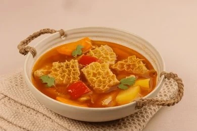 Traditional Colombian Mondongo soup with tripe, vegetables, and herbs