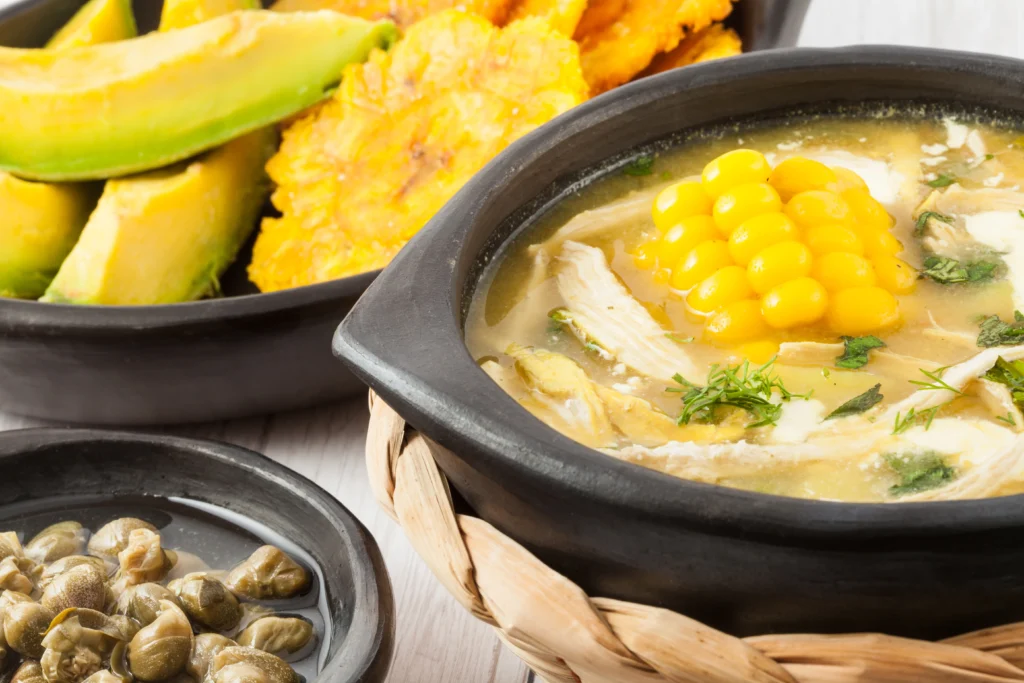 Ajiaco, Colombian chicken and potato soup served with corn and avocado